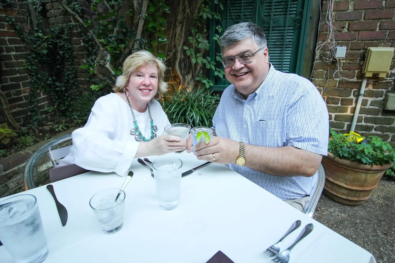 Two diners at a romantic evening in the courtyard at NoJa in Mobile, Alabama